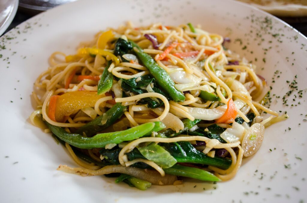 Colorful stir fry noodles with fresh vegetables, perfect for healthy meals.